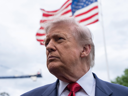 President Donald Trump speaks to press on the South Lawn of the White House before boardin
