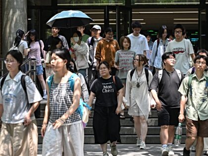Chinese students walk at Beijing Foreign Studies University in Beijing on May 29, 2025. Be