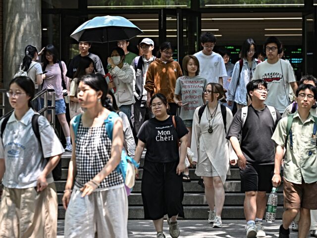 Chinese students walk at Beijing Foreign Studies University in Beijing on May 29, 2025. Be