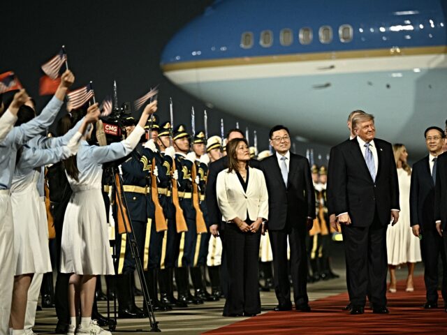 donald trump arrives US President Donald Trump (C) is escorted by China's Vice President Han Zheng (R) upon his