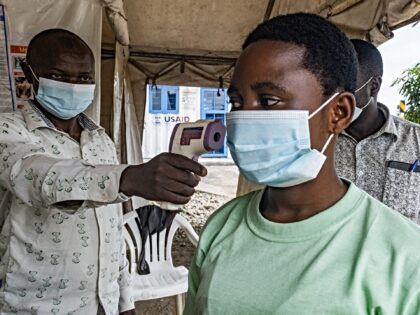A border health officer at the Busunga crossing between Uganda and the Democratic Republic
