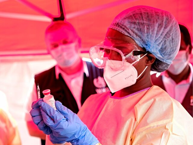ebola vaccine (1) KAMPALA, UGANDA - FEBRUARY 3: A member of a medical team at Mulago Referral Hospital prepa