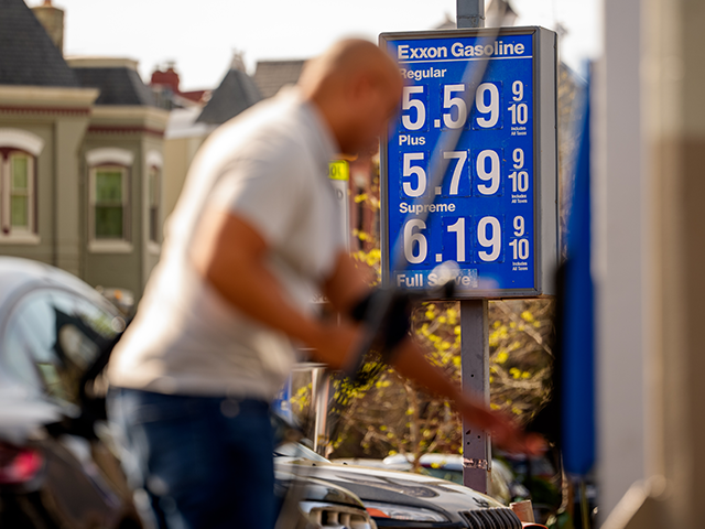 A person pumps gas at an Exxon gas station on March 31, 2026, in Washington, DC. (Andrew H