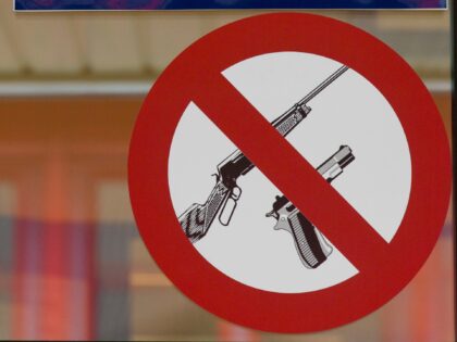 Prohibition sign forbidding firearms in bank, Longyearbyen, Svalbard / Spitsbergen, Norway