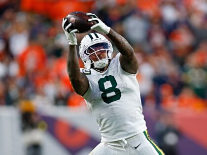 DENVER, CO - DECEMBER 14: Josh Jacobs #8 of the Green Bay Packers catches a pass during th