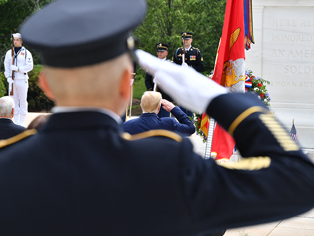 memorial-day-veterans-getty US President Donald Trump salutes as he participates in a Wreath Laying Ceremony at the To