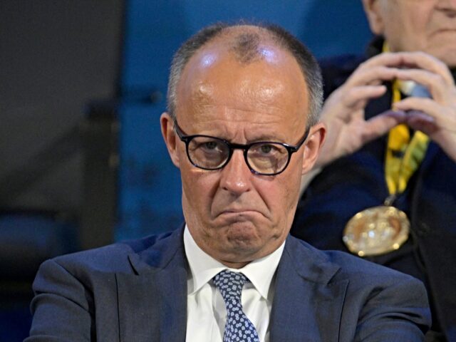 German Chancellor Friedrich Merz listens to speeches as the former President of the Europe