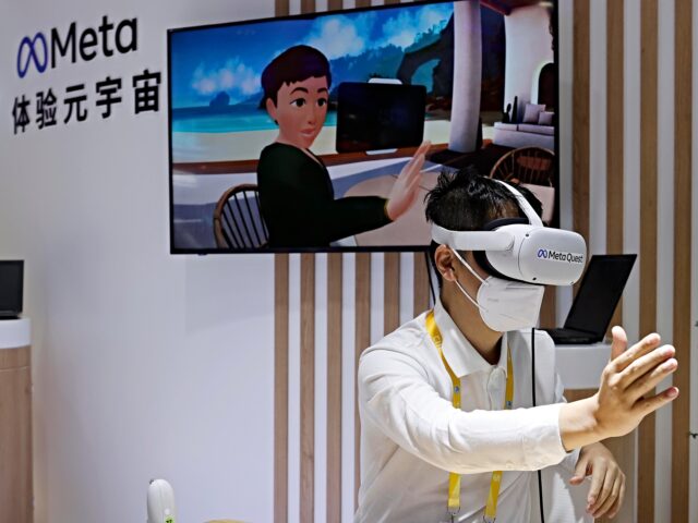 SHANGHAI, CHINA - NOVEMBER 05: A visitor tries VR headset at the booth of Meta during the