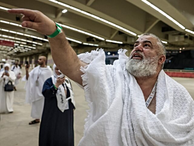 A Muslim pilgrim performs the symbolic 'stoning of the devil' ritual as part of the Hajj p