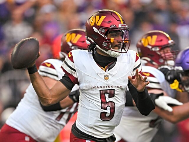 MINNEAPOLIS, MN - DECEMBER 07: Washington Commanders quarterback Jayden Daniels (5) looks