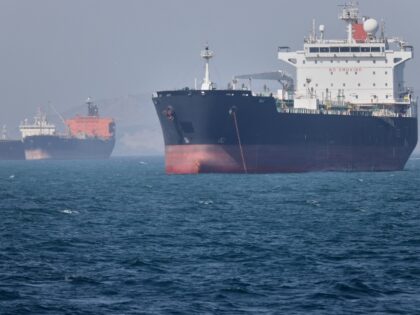 Oil tankers sit at anchor offshore in the Strait of Hormuz off Bandar Abbas, Iran, Saturda