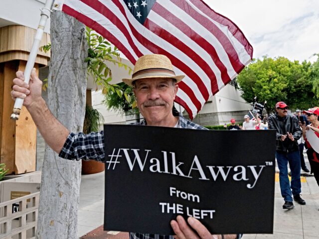 Trump supporters gather as part of the "American Restoration Tour" to persuade people to w