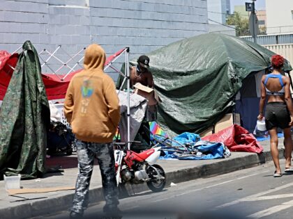 Los Angeles, CA - June 25: Tents and belongings in homeless encampments block the sidewalk