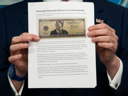 Secretary of Treasury Scott Bessent shows a proposed $250 bill featuring President Donald