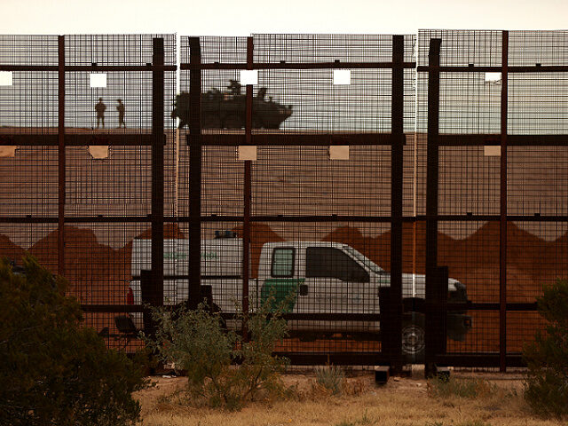 A US Border Patrol vehicle is seen near the construction of a secondary border wall in San