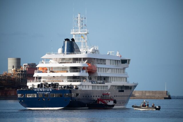 Boats approach the MV Hondius after it arrived at the port of Granadilla on Tenerife on Ma