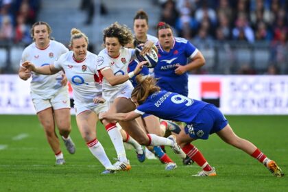 Ellie Kildunne (C) is tackled by France's Pauline Bourdon Sansus (R) during England&#