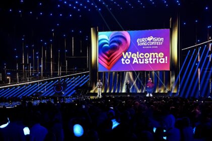 The Eurovision mascot for 2026 is Auri, who wears golden headphones