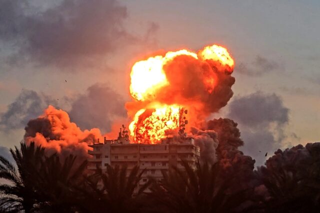 A fireball erupts from a building following an Israeli strike in Tyre