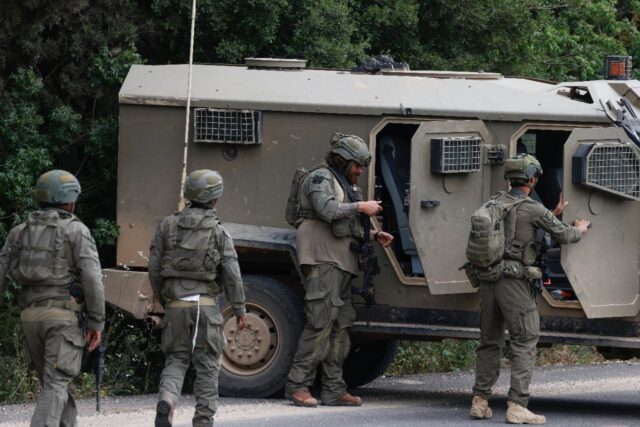 Israeli soldiers took cover near the Israel-Lebanon border following a Hezbollah drone att