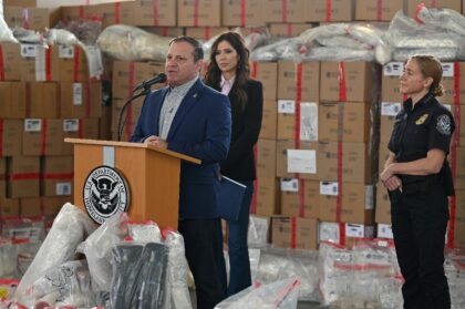 Michael Banks spoke alongside then-Secretary of Homeland Security Kristi Noem at an event
