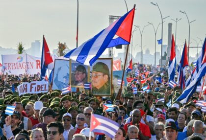 People attend a rally in support of former Cuban president Raul Castro, 94, who has been i