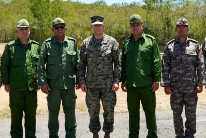 This photo shared by US Southern Command shows US Commander General Francis L. Donovan (C)