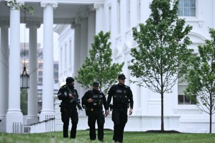 Secret Service agents patrol the White House grounds after a lockdown was lifted on May 23