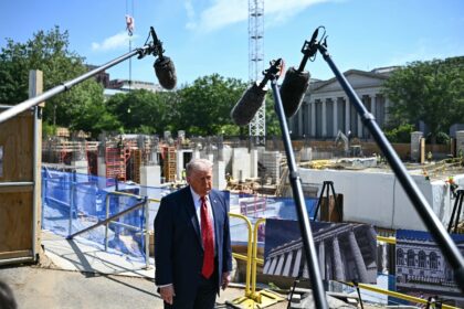 US President Donald Trump speaks to the press near the construction site of his proposed b