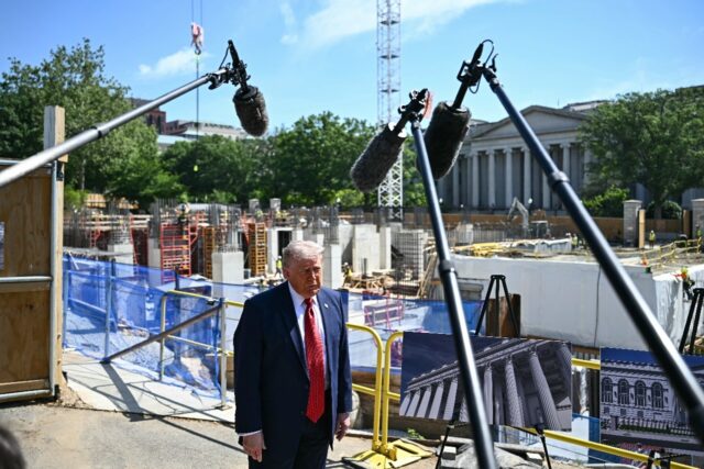 US President Donald Trump speaks to the press near the construction site of his proposed b