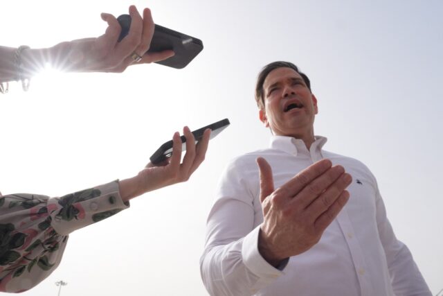 US Secretary of State Marco Rubio speaks to journalists before boarding his plane in New D