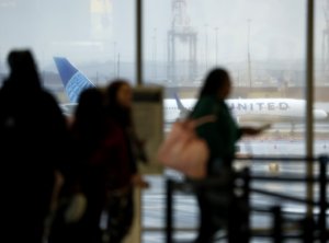 United Airlines flight strikes turnpike light pole, injuring driver