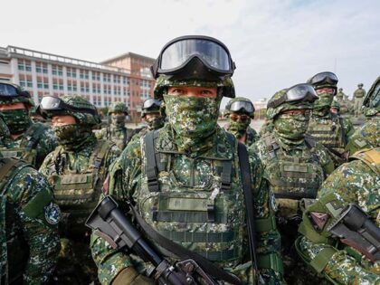 Title: Taiwan China Image ID: 23011357141880 Article: Soldiers stand guard after a prepare