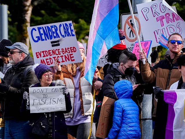 Title: Trump Transgender Health Care Image ID: 25044017565188 Article: FILE - People wave
