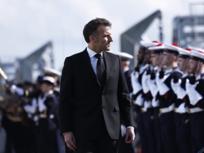 French President Emmanuel Macron reviews the troops during his visit to the nuclear submar