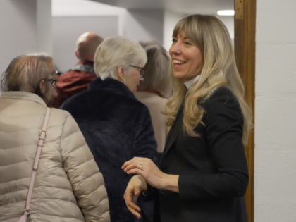 Rev. Sarah Trone Garriott, a Lutheran pastor and Iowa state senator, greets congregants at