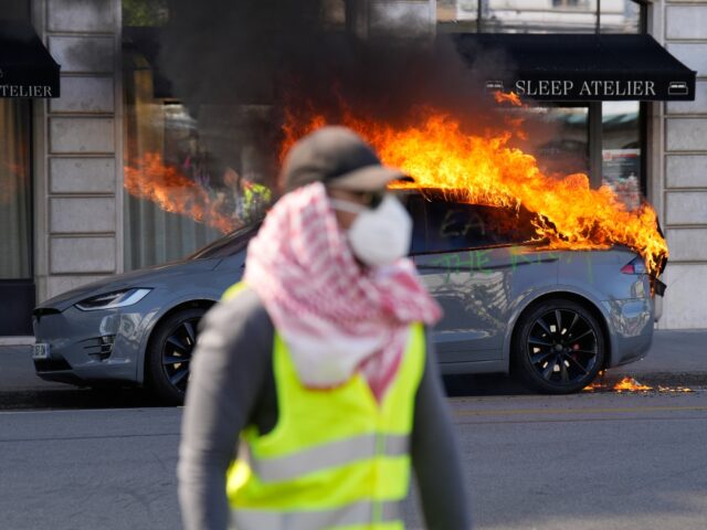 Far Leftists Torch Tesla, Smash Shop Windows, Clash With Cops at G7 Summit in Geneva