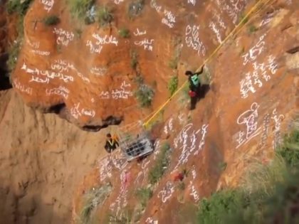 This screengrab from video, released by Yemeni Civil Defense Authority, shows rescuers rem