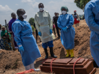 Red Cross workers prepare to bury Vanisa Anifa, a 6-month-old orphaned girl who died of Eb