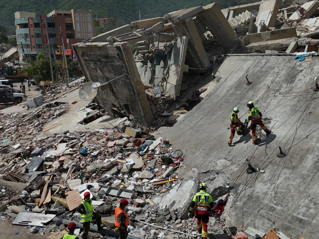 Mexican Army rescue workers search for people trapped in collapsed buildings after earthqu