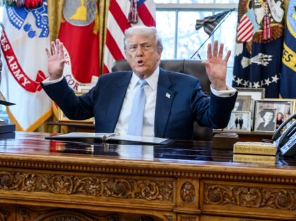President Donald Trump speaks with Press Secretary Karoline Leavitt, Secretary of Homeland