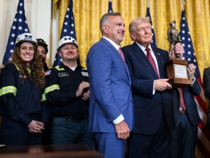 President and CEO of Peabody Energy Jim Grech presents an award to President Donald Trump