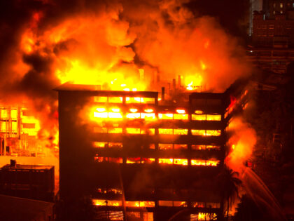 A massive fire engulfs the seven-storey Adams Caps and Textile Limited factory in Zone 5 o