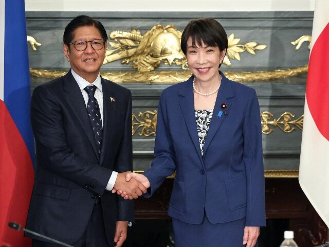 Ferdinand Marcos Jr. and Sanae Takaichi Japan's Prime Minister Sanae Takaichi (R) shakes hands with Philippines' Preside