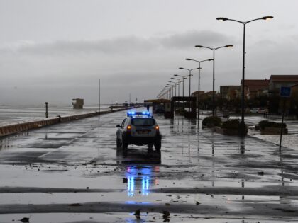 A police vehicle drives along the Narbonne beach seafront in southern France following ove