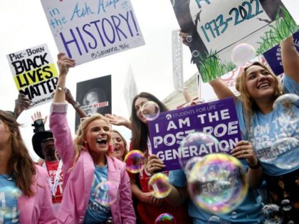 Anti-abortion campaigners celebrate outside the US Supreme Court in Washington, DC, on Jun