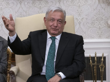 Andres Manuel Lopez Obrador, Mexico's president, with a translator, left, during a meeting