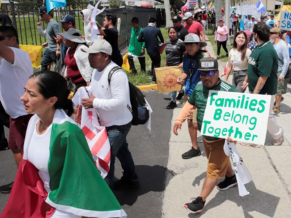 Protesters against a new immigration law march along Palm Beach Boulevard in Fort Myers, F