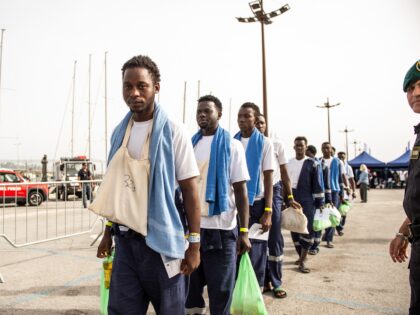 SALERNO, ITALY - OCTOBER 16: Migrants disembark from the Solidaire ship in the port of Sal