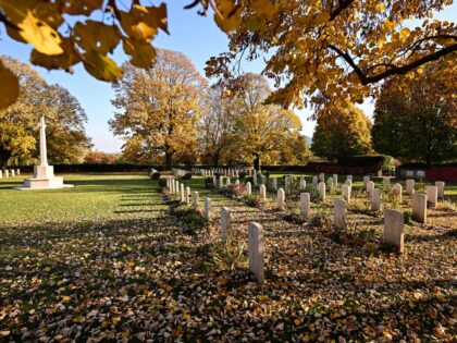 Head stones and The Cross of Sacrifice are pictured at Budapest War Cemetery, close to Sol